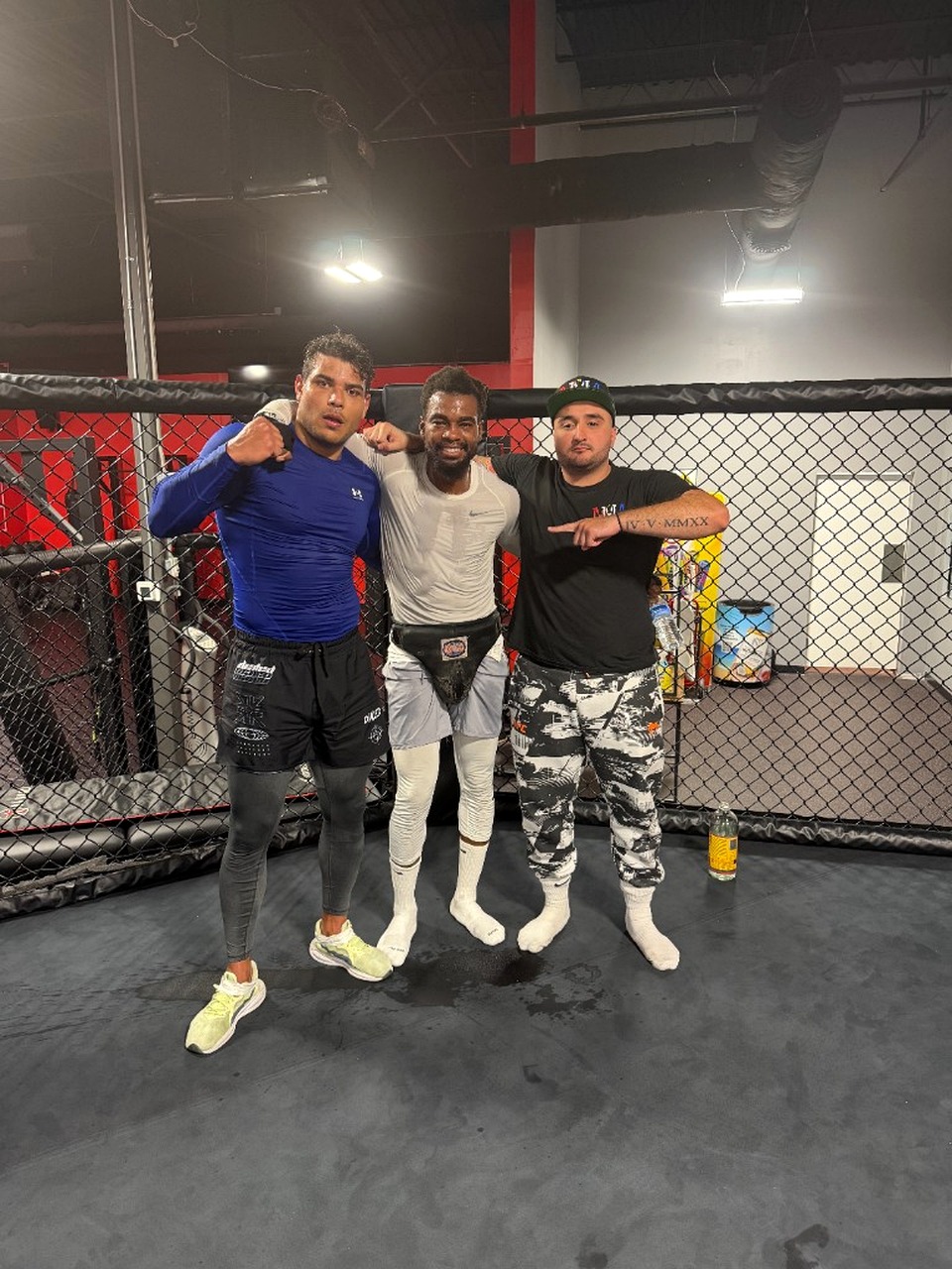 Frankie Solomon sparring with Paulo Costa in the cage