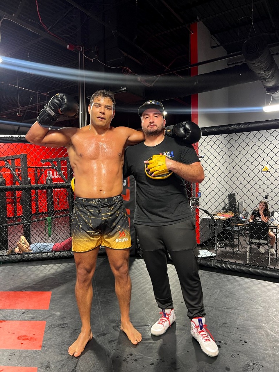 Mitt Man Manny mittwork session with Paulo Costa in the cage